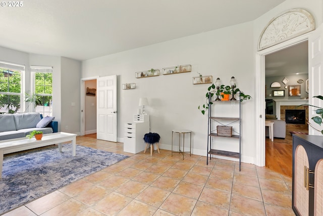 8503 SE 139th Ct, Portland, OR 97236 - living room featuring light tile patterned flooring and a tile fireplace
