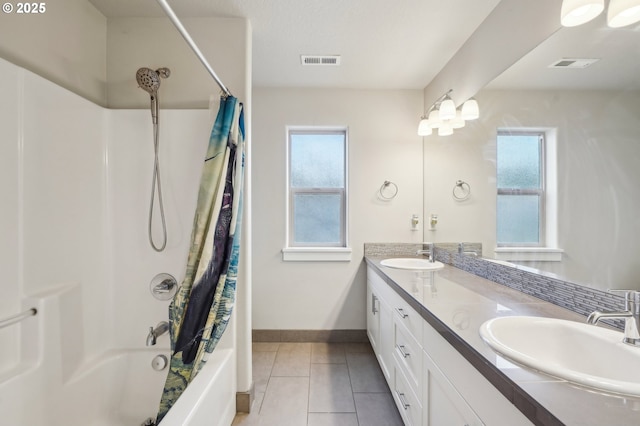 bathroom featuring a sink, visible vents, and plenty of natural light