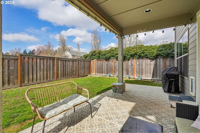 view of patio / terrace featuring grilling area and a fenced backyard