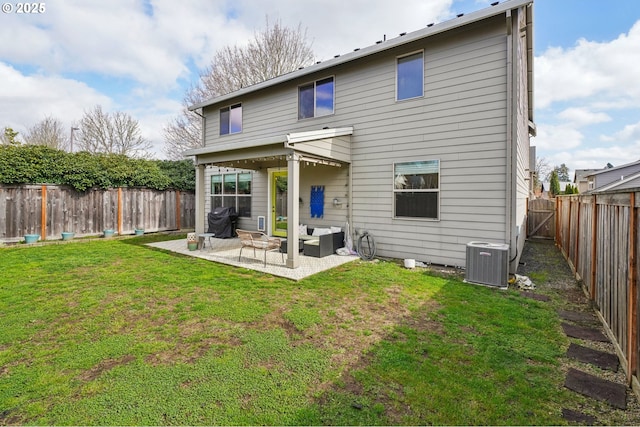 back of house with cooling unit, outdoor lounge area, a fenced backyard, a yard, and a patio area