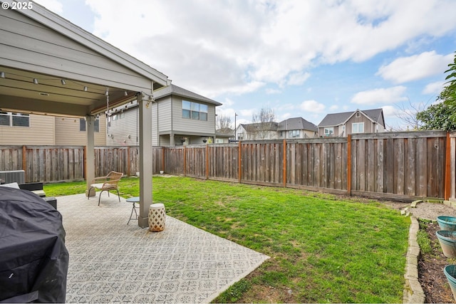 view of yard with a patio and a fenced backyard