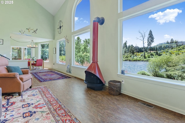91060 Leashore Dr, Vida, OR 97488 - living room with baseboards, a chandelier, high vaulted ceiling, and wood finished floors