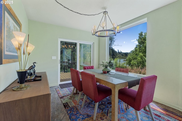 91060 Leashore Dr, Vida, OR 97488 - dining area featuring a chandelier and baseboards