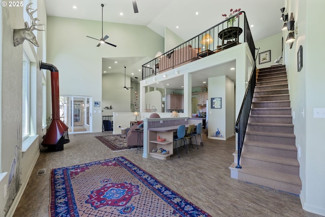 91060 Leashore Dr, Vida, OR 97488 - living area featuring ceiling fan, stairs, recessed lighting, high vaulted ceiling, and baseboards
