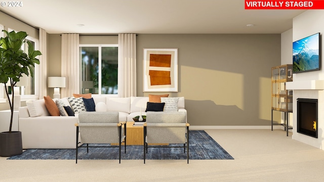 carpeted living room featuring baseboards and a lit fireplace