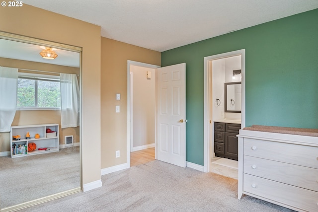 164 Yelton Dr, Longview, WA 98632 - carpeted bedroom featuring visible vents, baseboards, and ensuite bathroom