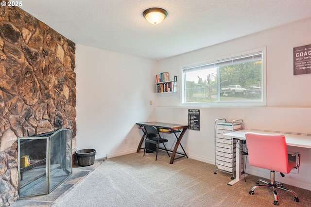 164 Yelton Dr, Longview, WA 98632 - carpeted office featuring baseboards, a fireplace, and a textured ceiling