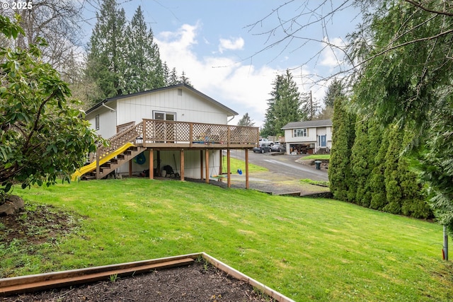 164 Yelton Dr, Longview, WA 98632 - back of property featuring a deck, a lawn, and stairs