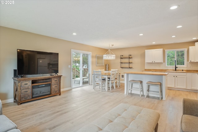 164 Yelton Dr, Longview, WA 98632 - living room featuring light wood-style floors, baseboards, and recessed lighting
