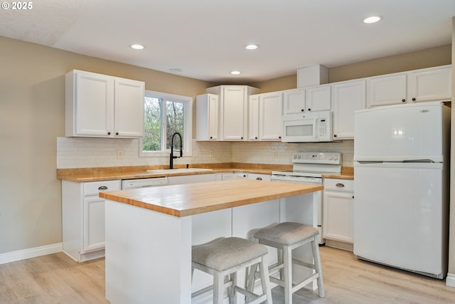 164 Yelton Dr, Longview, WA 98632 - kitchen with wood counters, white appliances, white cabinetry, and a sink