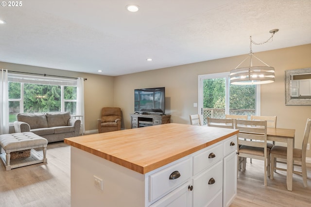 164 Yelton Dr, Longview, WA 98632 - kitchen featuring recessed lighting, open floor plan, white cabinetry, wooden counters, and light wood-style floors