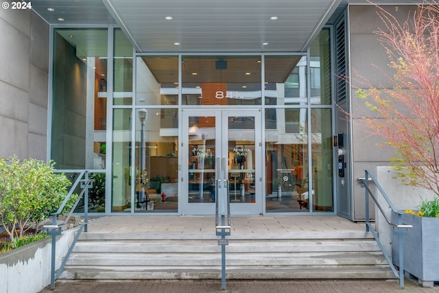 view of exterior entry featuring french doors