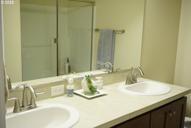 full bathroom featuring a shower stall and double vanity