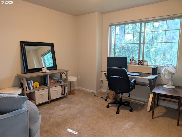 carpeted home office with baseboards
