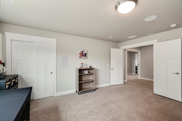 interior space featuring baseboards, a closet, and visible vents