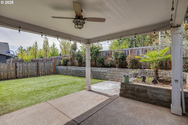 view of patio with a ceiling fan and a fenced backyard