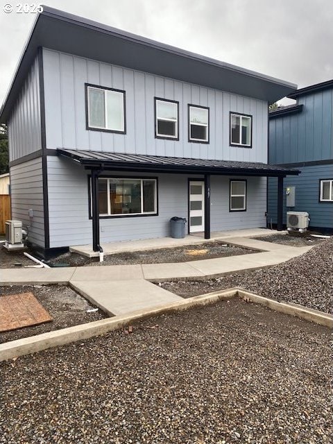 view of front of house featuring a patio and central air condition unit