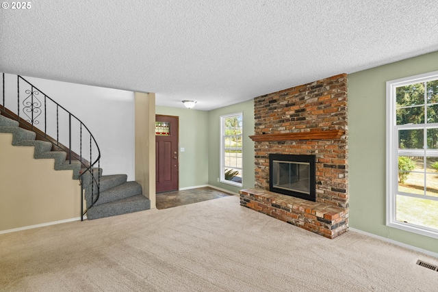 37276 Camp Creek Rd, Springfield, OR 97478 - unfurnished living room featuring a textured ceiling, stairway, carpet flooring, and baseboards