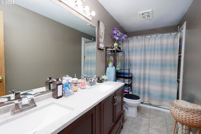 638 SE Polk St, Camas, WA 98607 - bathroom featuring double vanity, a shower with curtain, toilet, and tile patterned floors