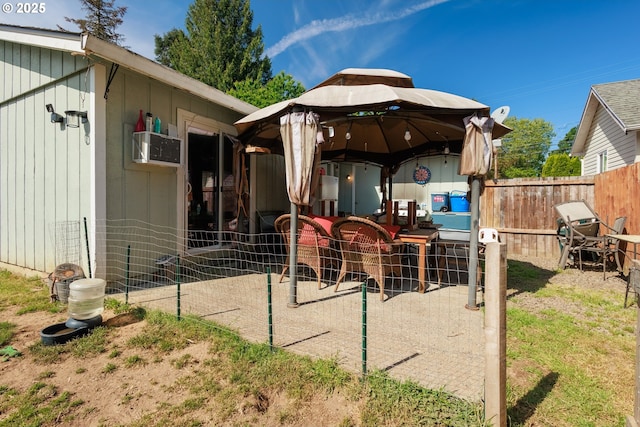 638 SE Polk St, Camas, WA 98607 - rear view of property featuring fence and a gazebo