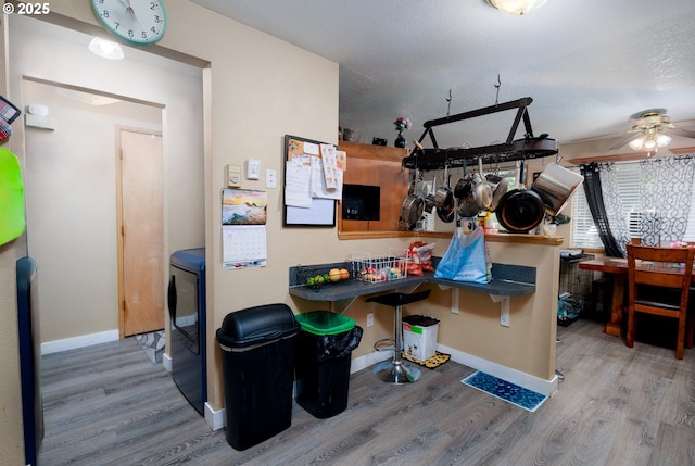 638 SE Polk St, Camas, WA 98607 - recreation room featuring wood finished floors, a ceiling fan, and baseboards
