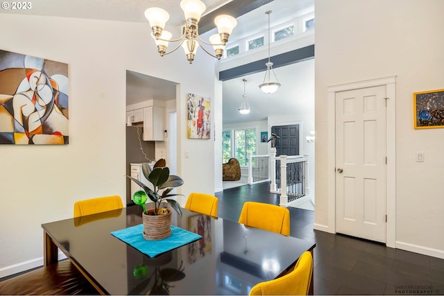 2022 Floral Hill Dr, Eugene, OR 97403 - dining area featuring a chandelier, a textured ceiling, baseboards, and dark wood-style flooring