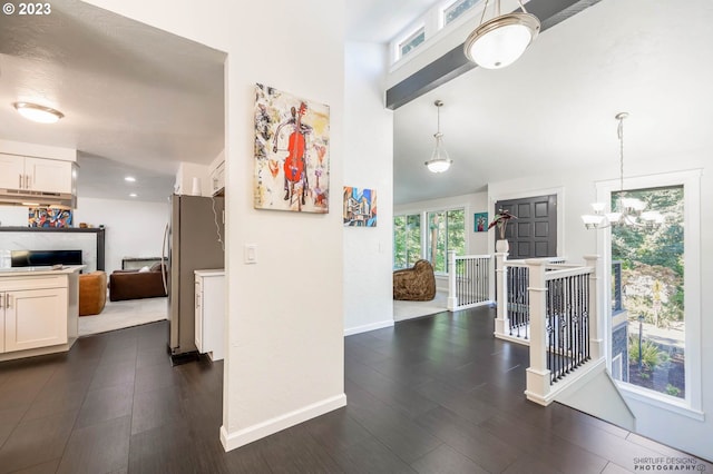 2022 Floral Hill Dr, Eugene, OR 97403 - dining room with a chandelier, a high ceiling, and baseboards