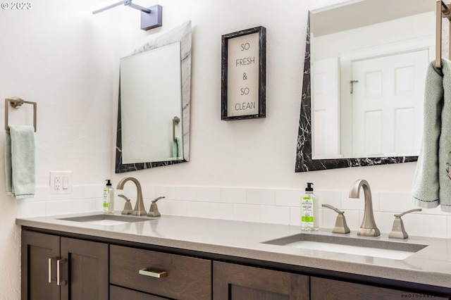 2022 Floral Hill Dr, Eugene, OR 97403 - full bath with marble look tile flooring, double vanity, and baseboards