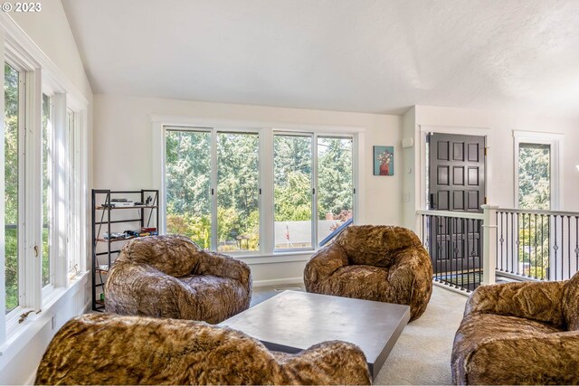 2022 Floral Hill Dr, Eugene, OR 97403 - living area featuring plenty of natural light, vaulted ceiling, carpet flooring, and a chandelier