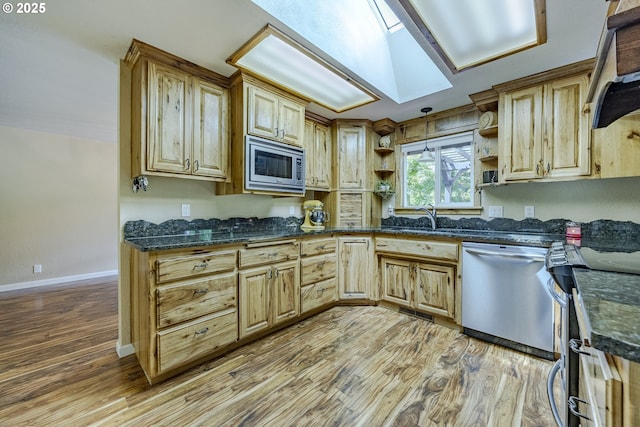 40211 Deerhorn Rd, Springfield, OR 97478 - kitchen with appliances with stainless steel finishes, open shelves, light wood finished floors, a sink, and a skylight