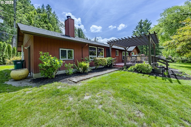 40211 Deerhorn Rd, Springfield, OR 97478 - back of property featuring a chimney, a pergola, a wooden deck, and a lawn