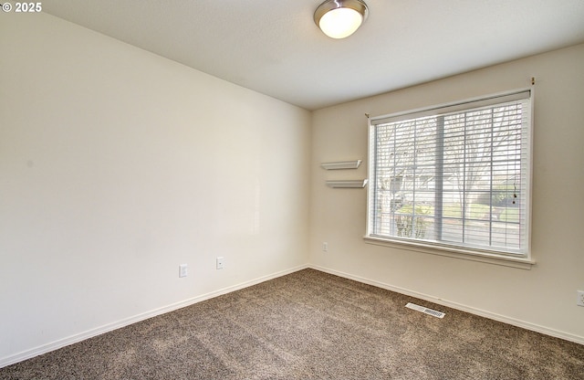 806 NW 15th Ave, Battle Ground, WA 98604 - spare room featuring dark colored carpet and baseboards