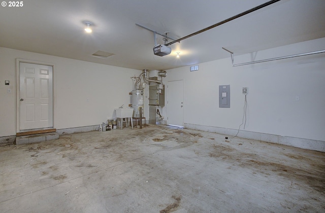 806 NW 15th Ave, Battle Ground, WA 98604 - garage featuring electric panel, a garage door opener, water heater, and heating unit