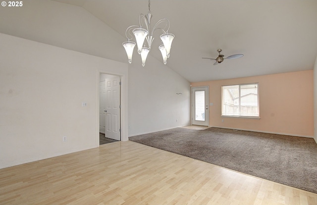 806 NW 15th Ave, Battle Ground, WA 98604 - unfurnished room featuring lofted ceiling, ceiling fan, wood finished floors, a chandelier, and baseboards