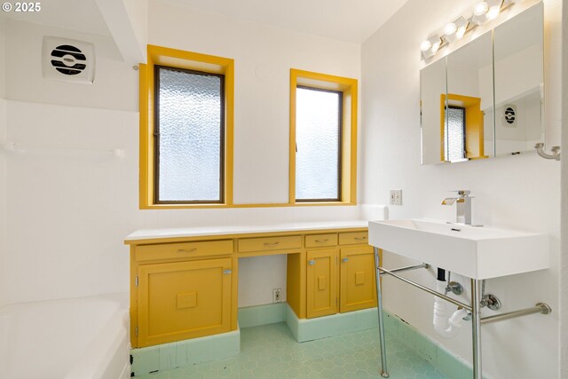 1940 SW 71st Ave, Portland, OR 97225 - full bathroom featuring a sink, a bath, and tile patterned flooring