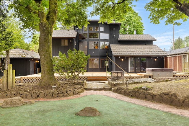 1940 SW 71st Ave, Portland, OR 97225 - rear view of property with a hot tub and a deck