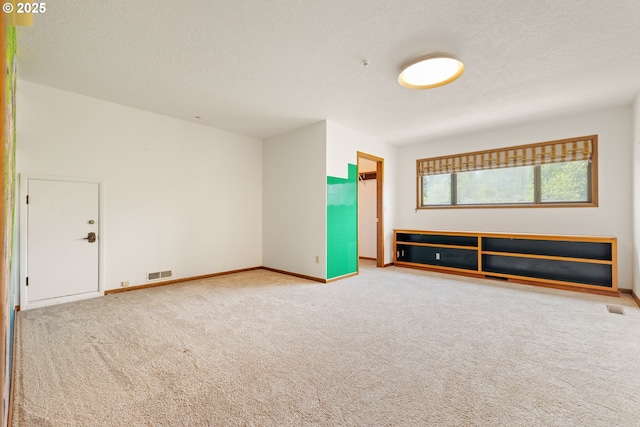 1940 SW 71st Ave, Portland, OR 97225 - carpeted empty room with baseboards and a textured ceiling