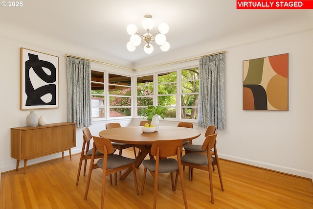 1940 SW 71st Ave, Portland, OR 97225 - dining space with a chandelier, light wood-style flooring, and baseboards