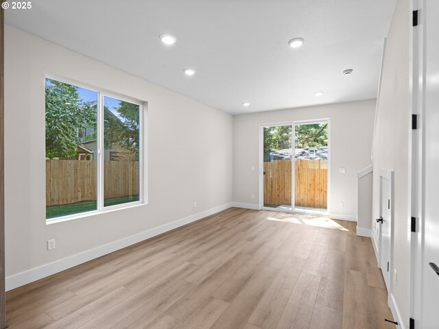 1580 NE 52nd Ave Unit 4, Portland, OR 97213 - unfurnished room featuring plenty of natural light, light wood-style flooring, recessed lighting, and baseboards