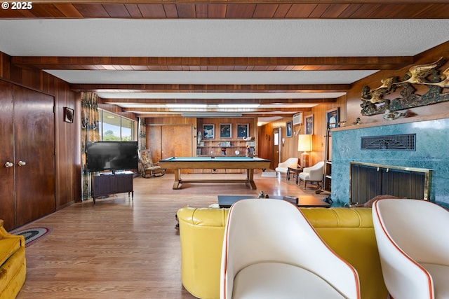 53767 E Honeyman Rd, Scappoose, OR 97056 - playroom with wood finished floors, wood walls, billiards table, beamed ceiling, and a fireplace