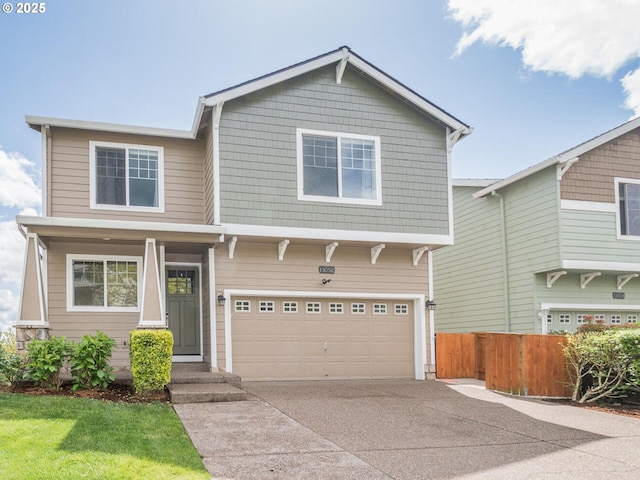 craftsman house featuring fence, driveway, and a garage