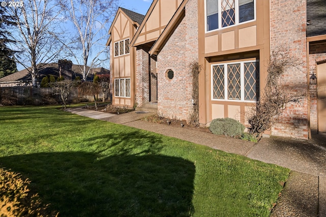 view of side of property featuring a yard