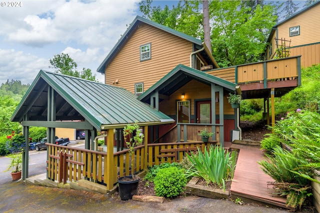 1650 Leatherwood Dr, Eugene, OR 97405 - rear view of property featuring a gazebo, metal roof, a deck, and a standing seam roof