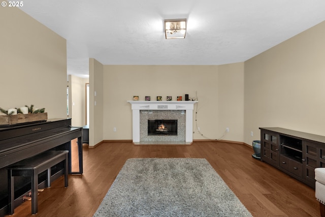 1820 Huckleberry Dr, Seaside, OR 97138 - living room with wood finished floors, a glass covered fireplace, and baseboards