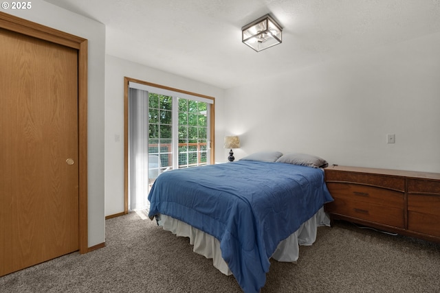 1820 Huckleberry Dr, Seaside, OR 97138 - bedroom with carpet flooring, access to exterior, and baseboards