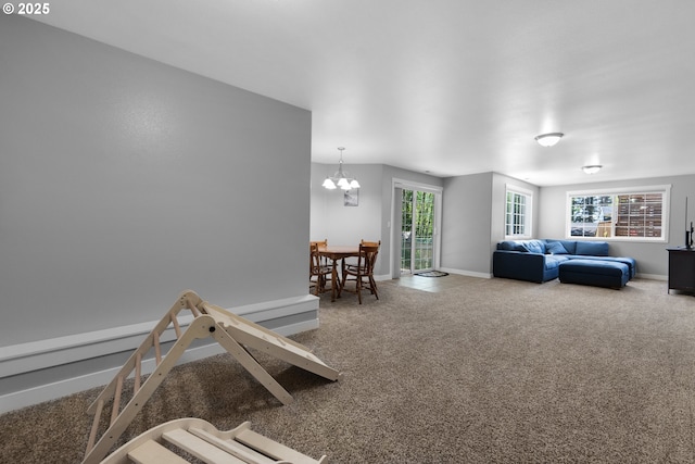 1820 Huckleberry Dr, Seaside, OR 97138 - carpeted living area featuring baseboards and a chandelier