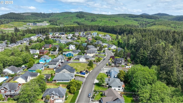 1820 Huckleberry Dr, Seaside, OR 97138 - view of property location featuring a heavily wooded area, nearby suburban area, and a mountainous background