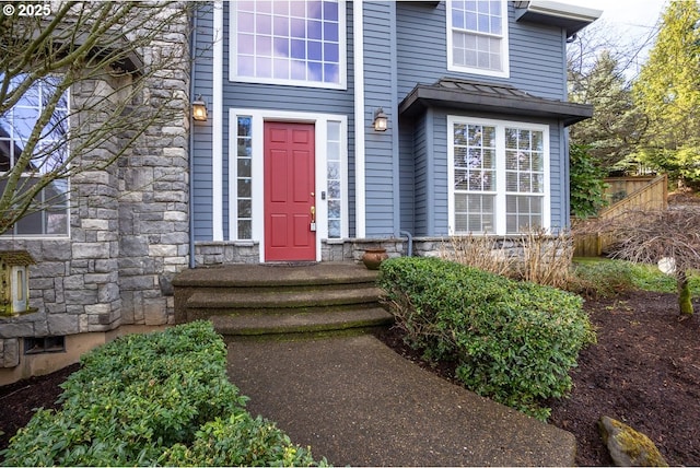 entrance to property with stone siding