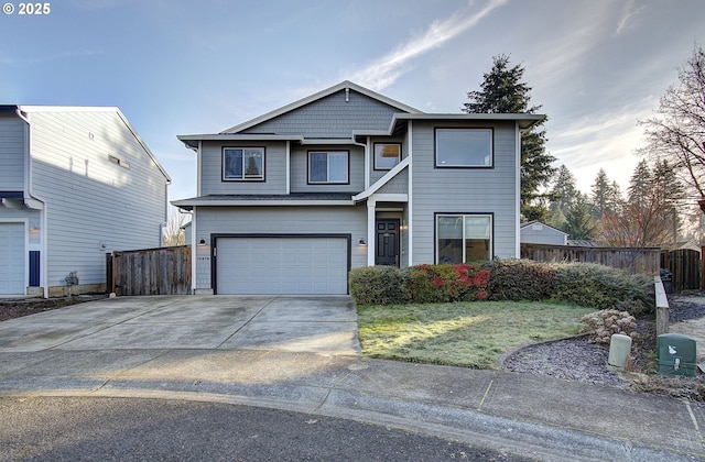 view of front of house with a garage and a front lawn