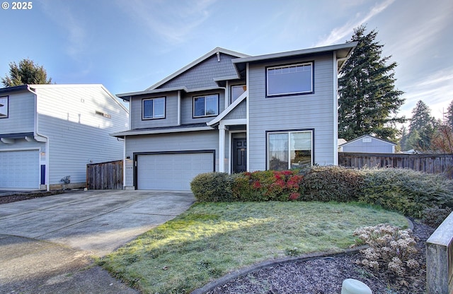 view of front of home with a front yard and a garage